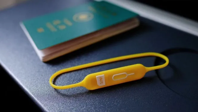 Open-top silicone card holder in green grey colour showing the internal card slot.