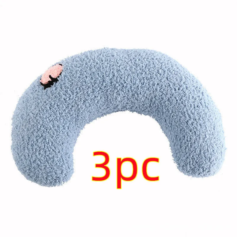 Small U-shaped plush pet pillow in blue for a cat or small dog to sleep on.