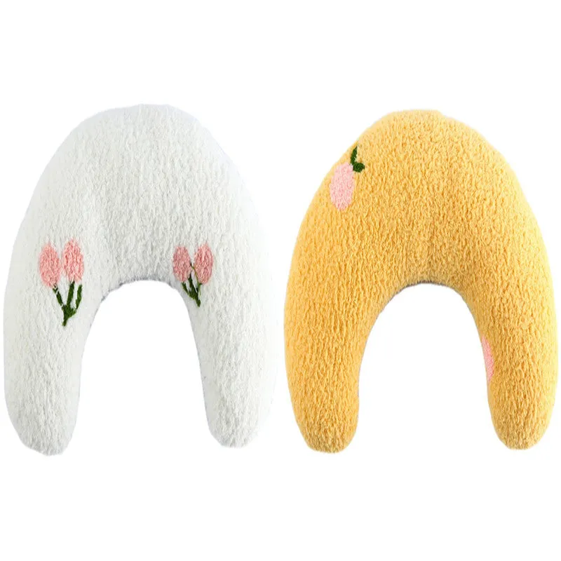 Small U-shaped plush pet pillow in blue for a cat or small dog to sleep on.