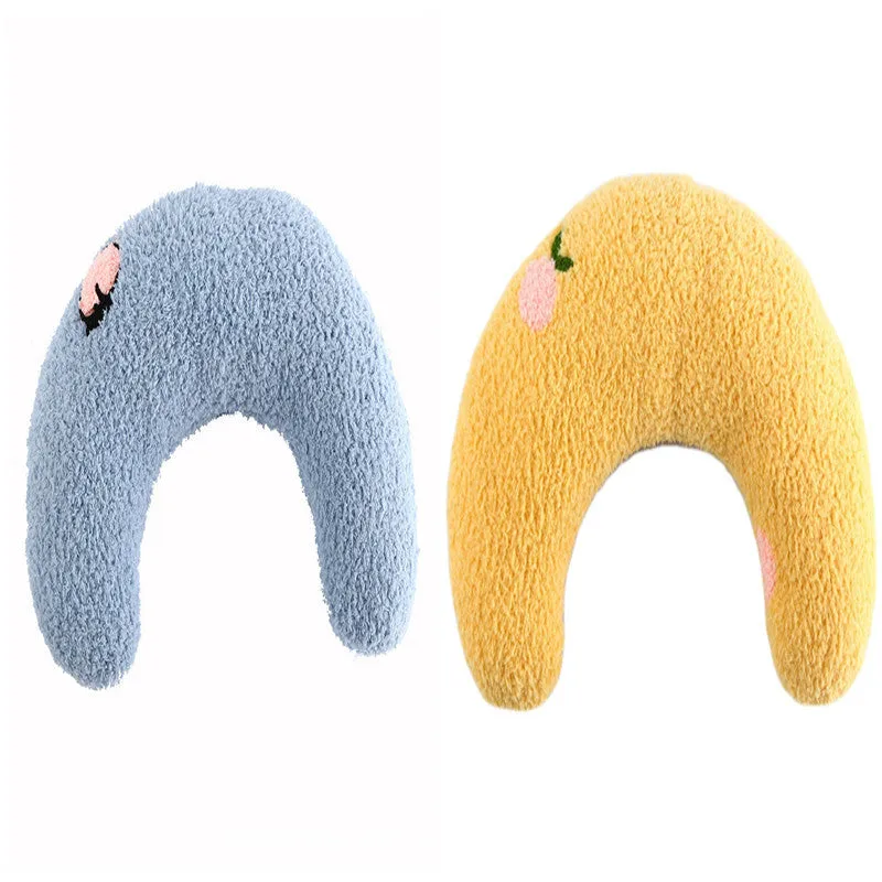 Small U-shaped plush pet pillow in blue for a cat or small dog to sleep on.