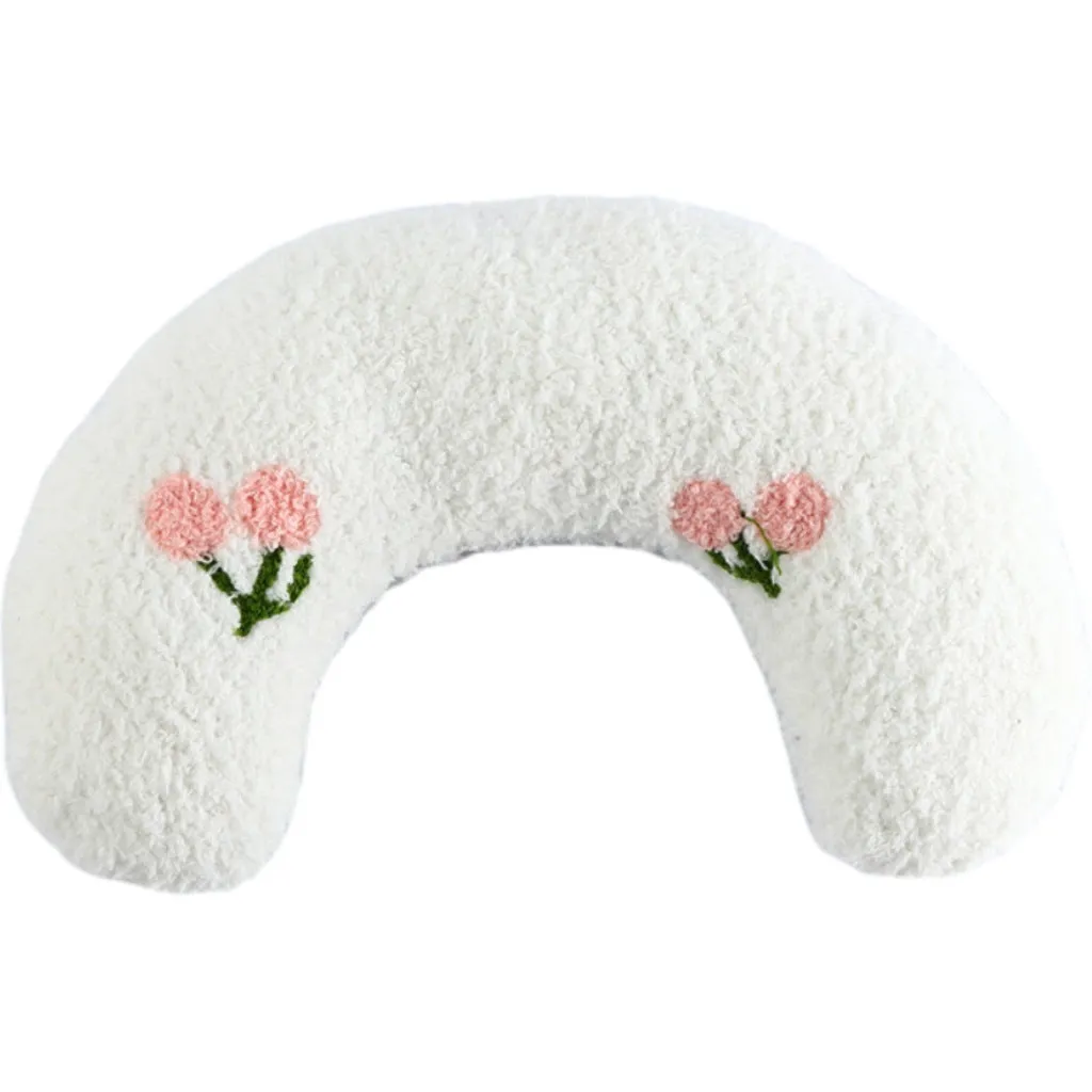 Small U-shaped plush pet pillow in blue for a cat or small dog to sleep on.