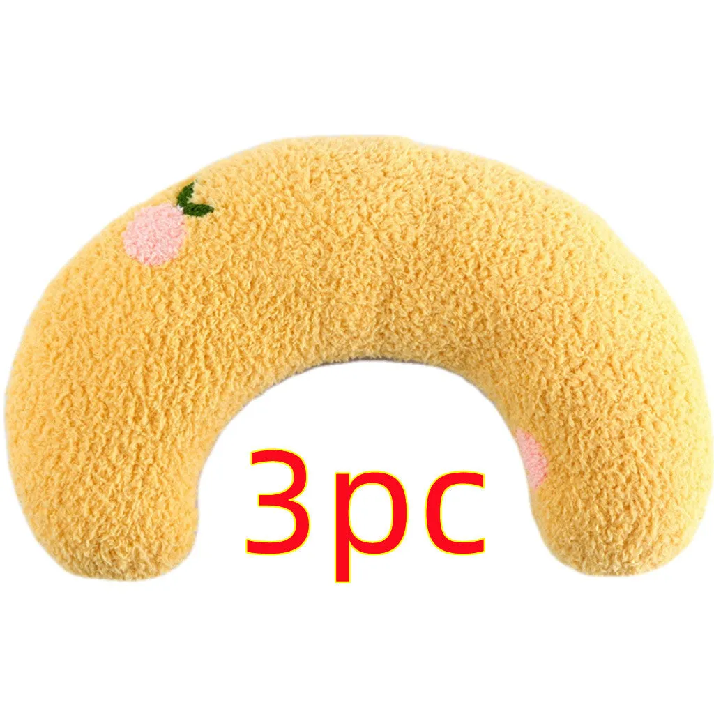 Small U-shaped plush pet pillow in blue for a cat or small dog to sleep on.