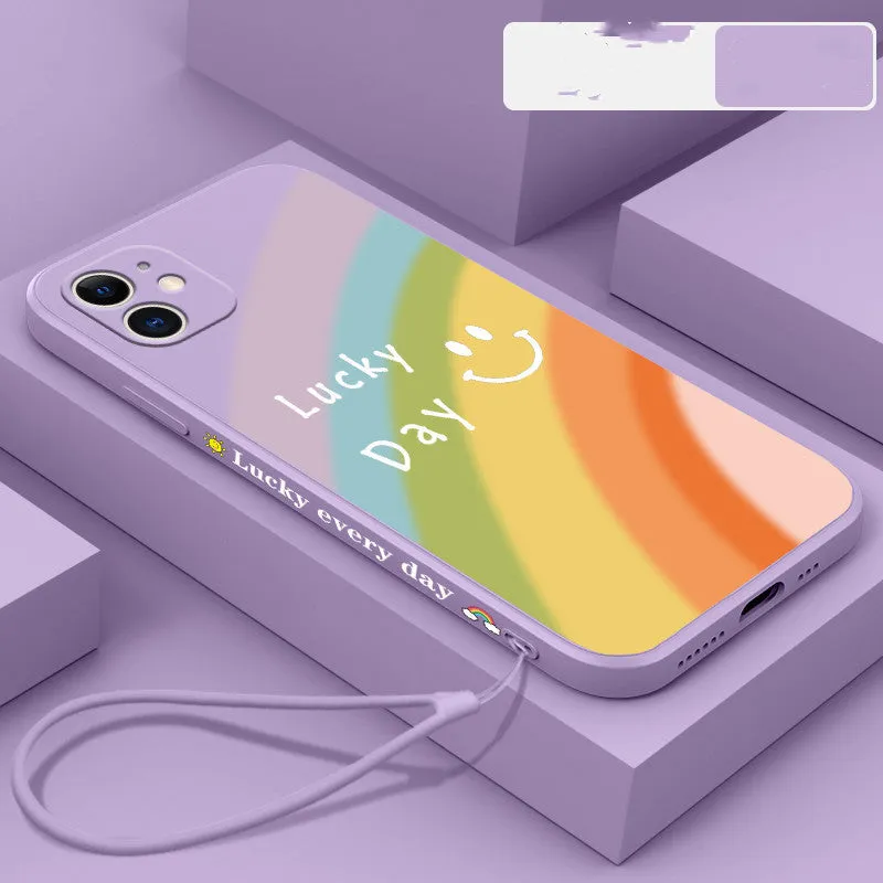 Rainbow smiley face silicone phone case for iPhone in blue, green, purple, and red colours.