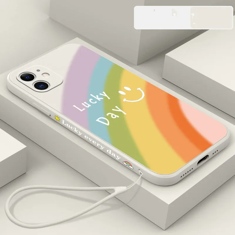Rainbow smiley face silicone phone case for iPhone in blue, green, purple, and red colours.
