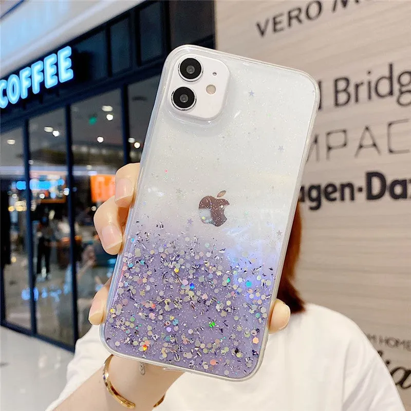 Glitter epoxy transparent phone case for iPhone 11 and iPhone 12 models on a table.