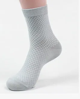 Pair of men's bamboo fibre business socks with small square pattern, shown in navy blue.