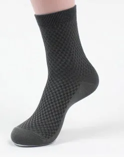 Pair of men's bamboo fibre business socks with small square pattern, shown in navy blue.