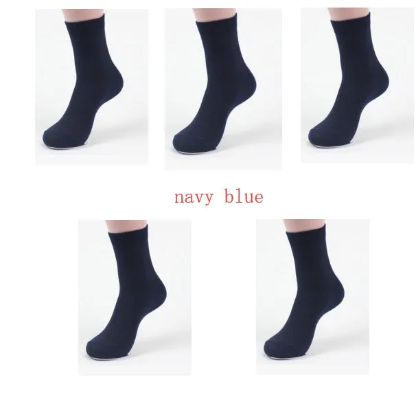 Pair of men's bamboo fibre business socks with small square pattern, shown in navy blue.