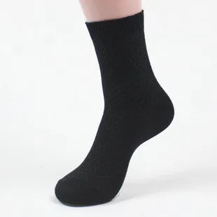 Pair of men's bamboo fibre business socks with small square pattern, shown in navy blue.