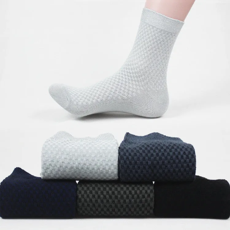 Pair of men's bamboo fibre business socks with small square pattern, shown in navy blue.