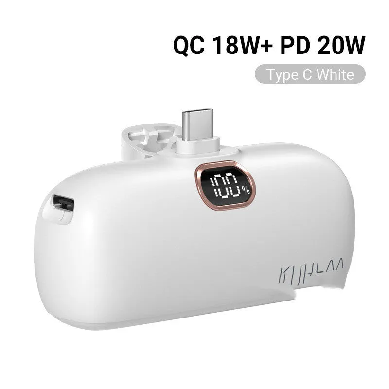 Compact cylindrical alloy power bank with built-in Lightning charging cable showing LCD display.