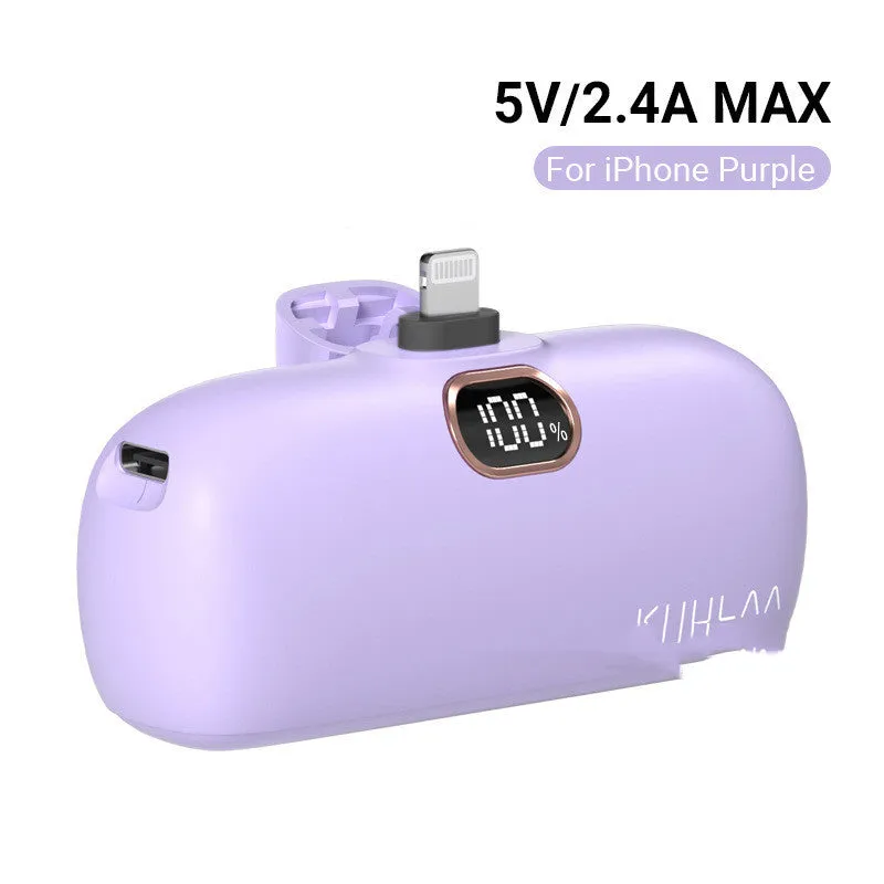 Compact cylindrical alloy power bank with built-in Lightning charging cable showing LCD display.