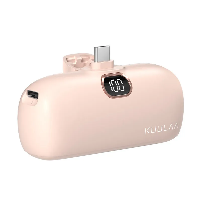 Compact cylindrical alloy power bank with built-in Lightning charging cable showing LCD display.