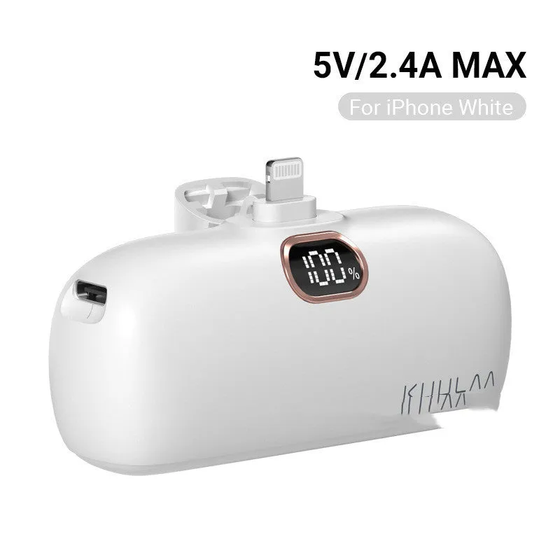 Compact cylindrical alloy power bank with built-in Lightning charging cable showing LCD display.