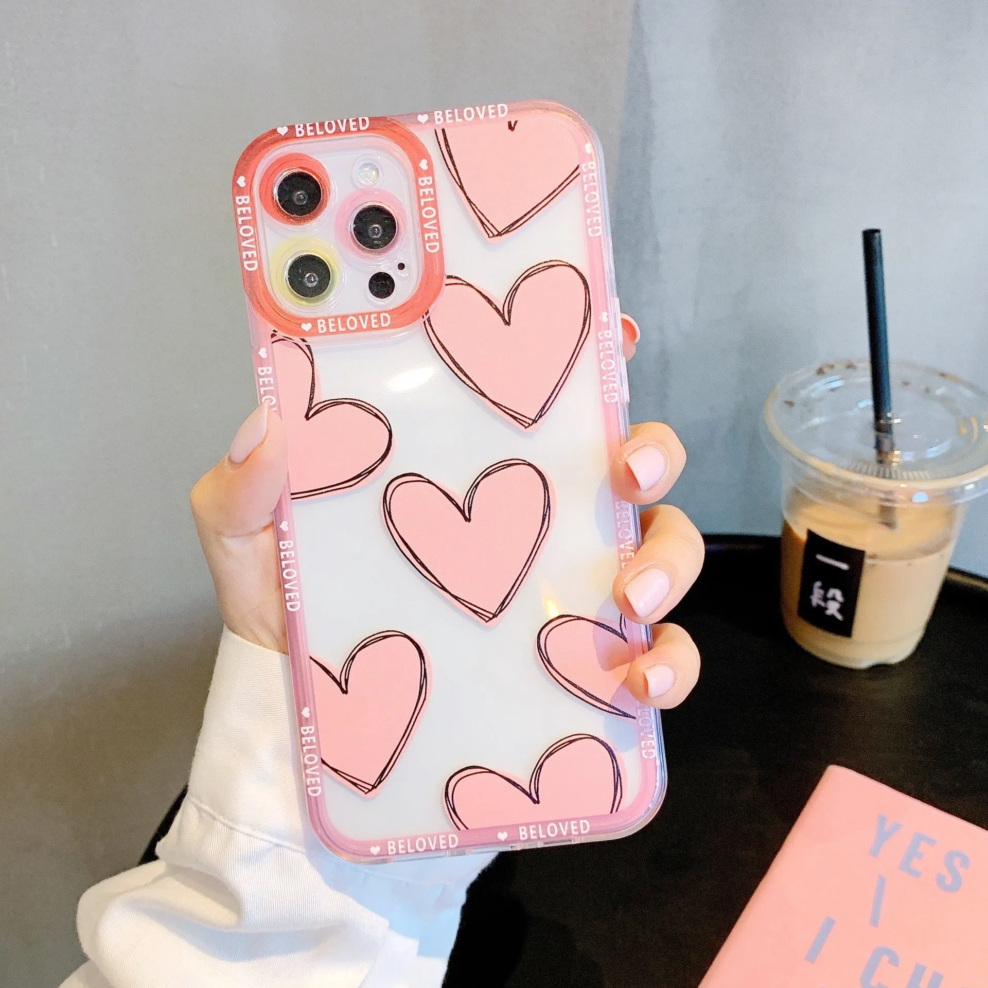 Pink mobile phone case with love heart and angel eyes design for iPhone.
