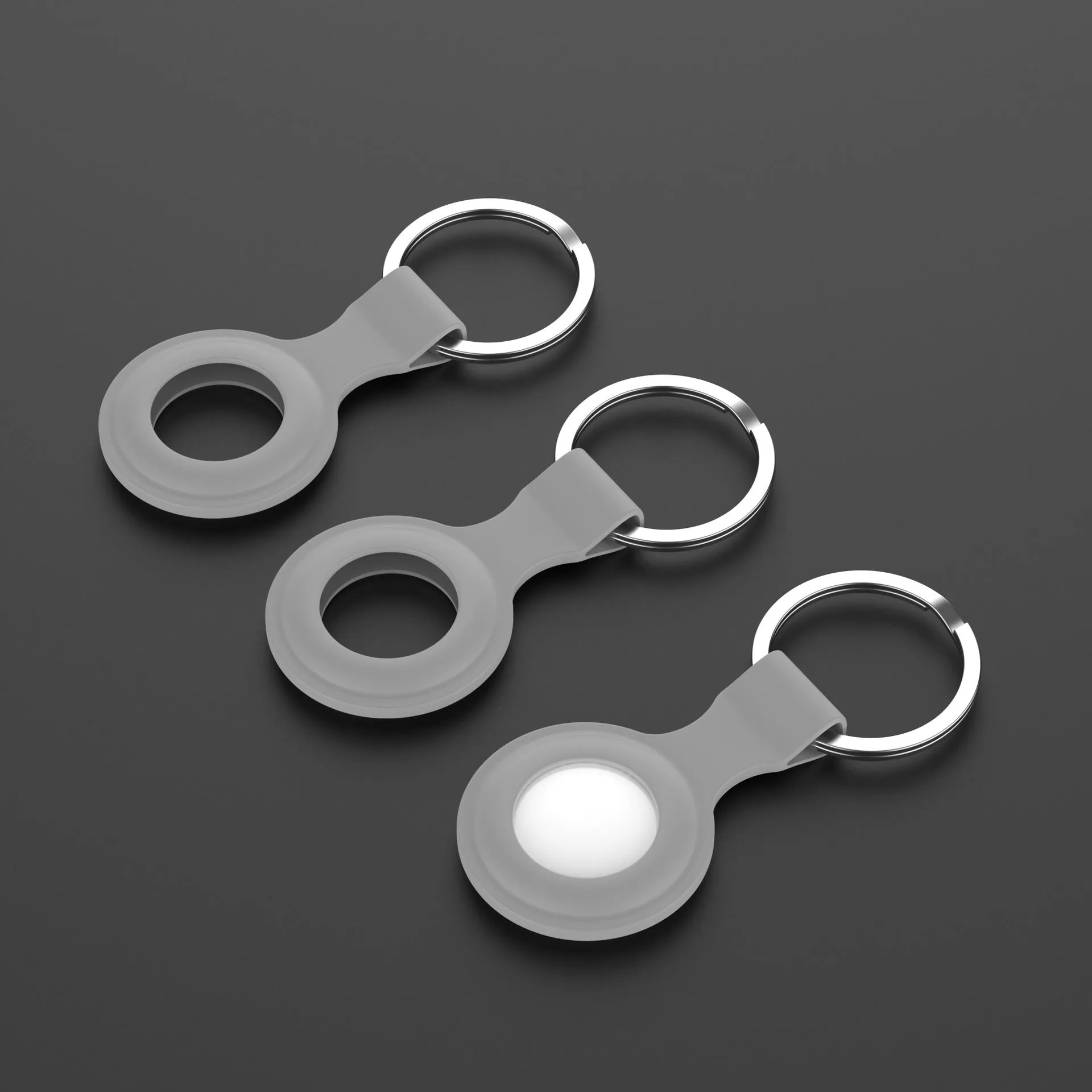 Silicone protective sleeve case for Apple AirTag tracker shown in multiple colour options.