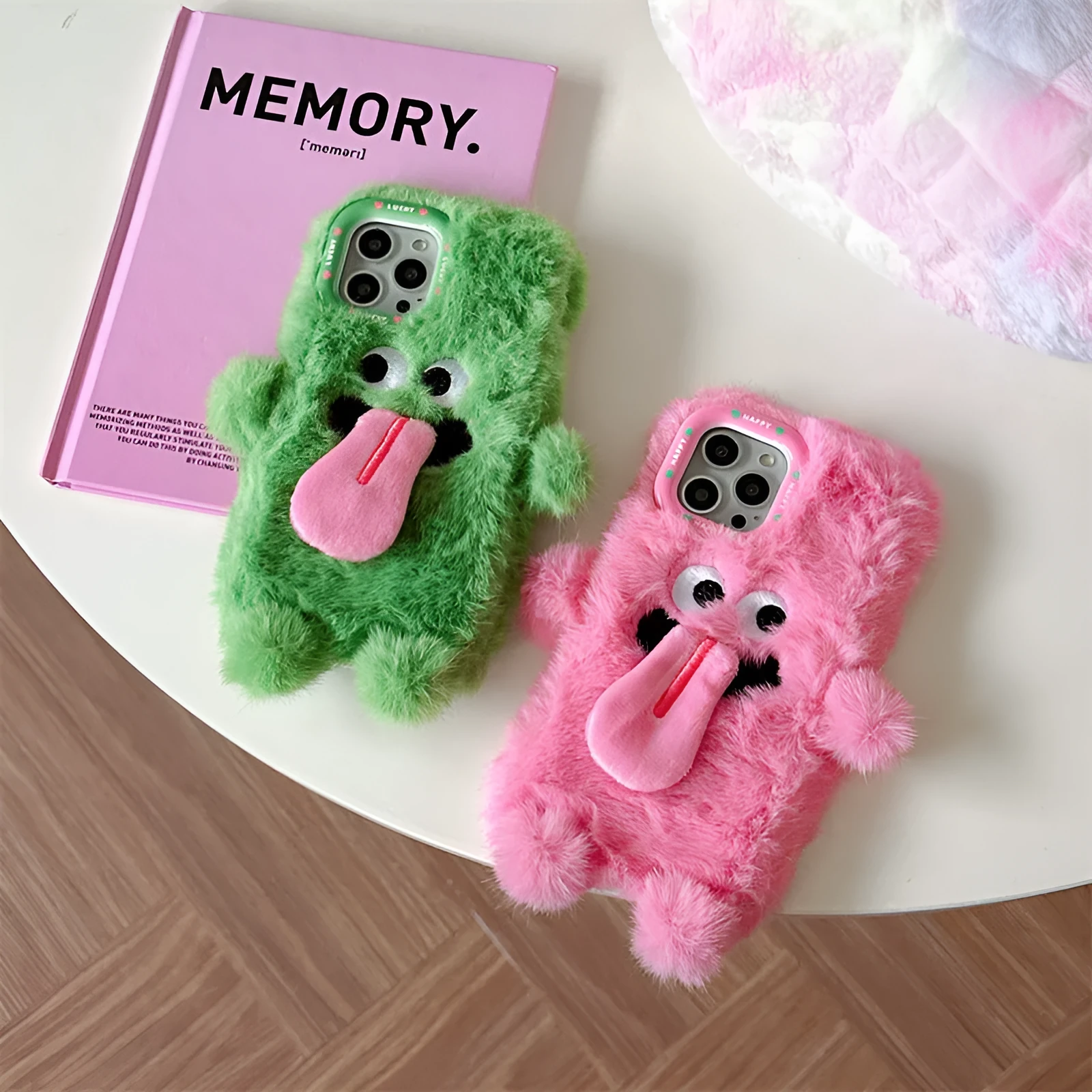 Soft plush phone case with green cartoon monster sticking tongue out, for iPhone.