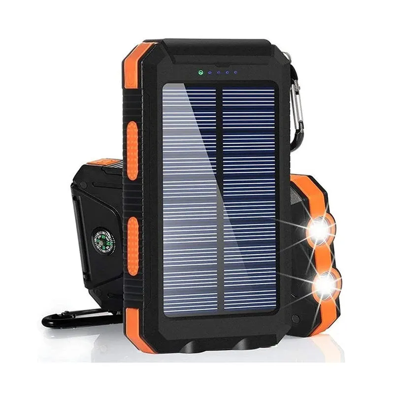 Black solar power bank showing LED flashlight, digital compass display, and solar panel on a rugged outdoor surface.