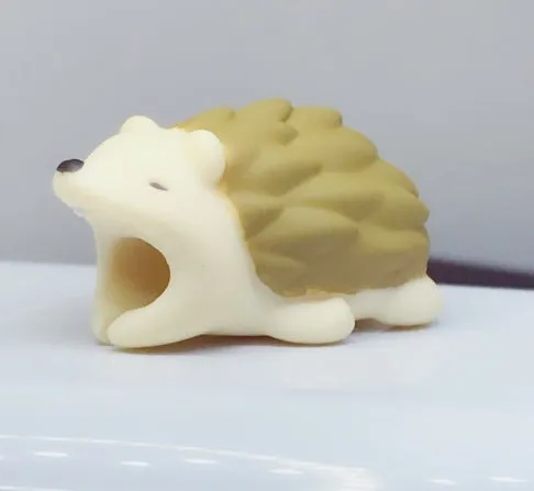 iPhone cable protector in an animal design, showing sleeve placed on charging cable near connector.
