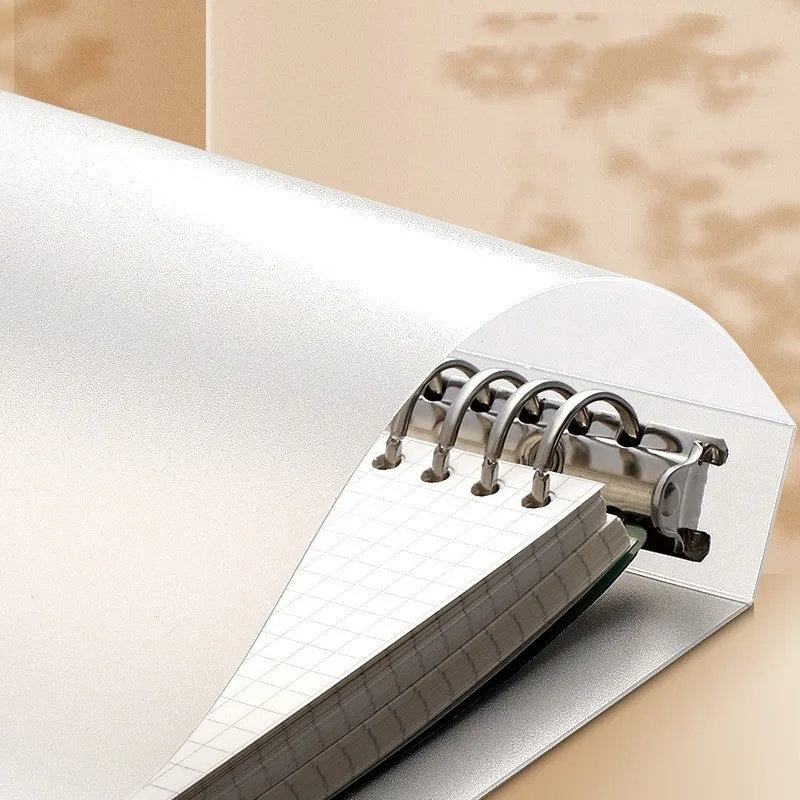 B5 hardcover detachable notebook open showing colour pages and binding system