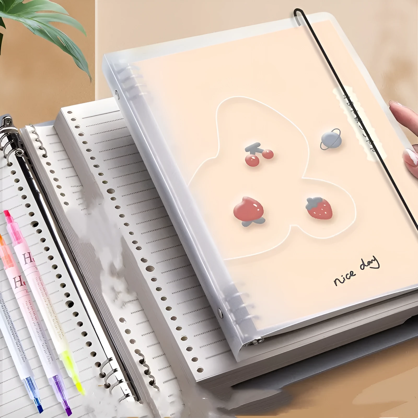 B5 hardcover detachable notebook open showing colour pages and binding system