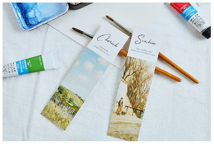Pack of 30 white cardboard art bookmarks with designs including flowers and patterns, next to their plastic carton.