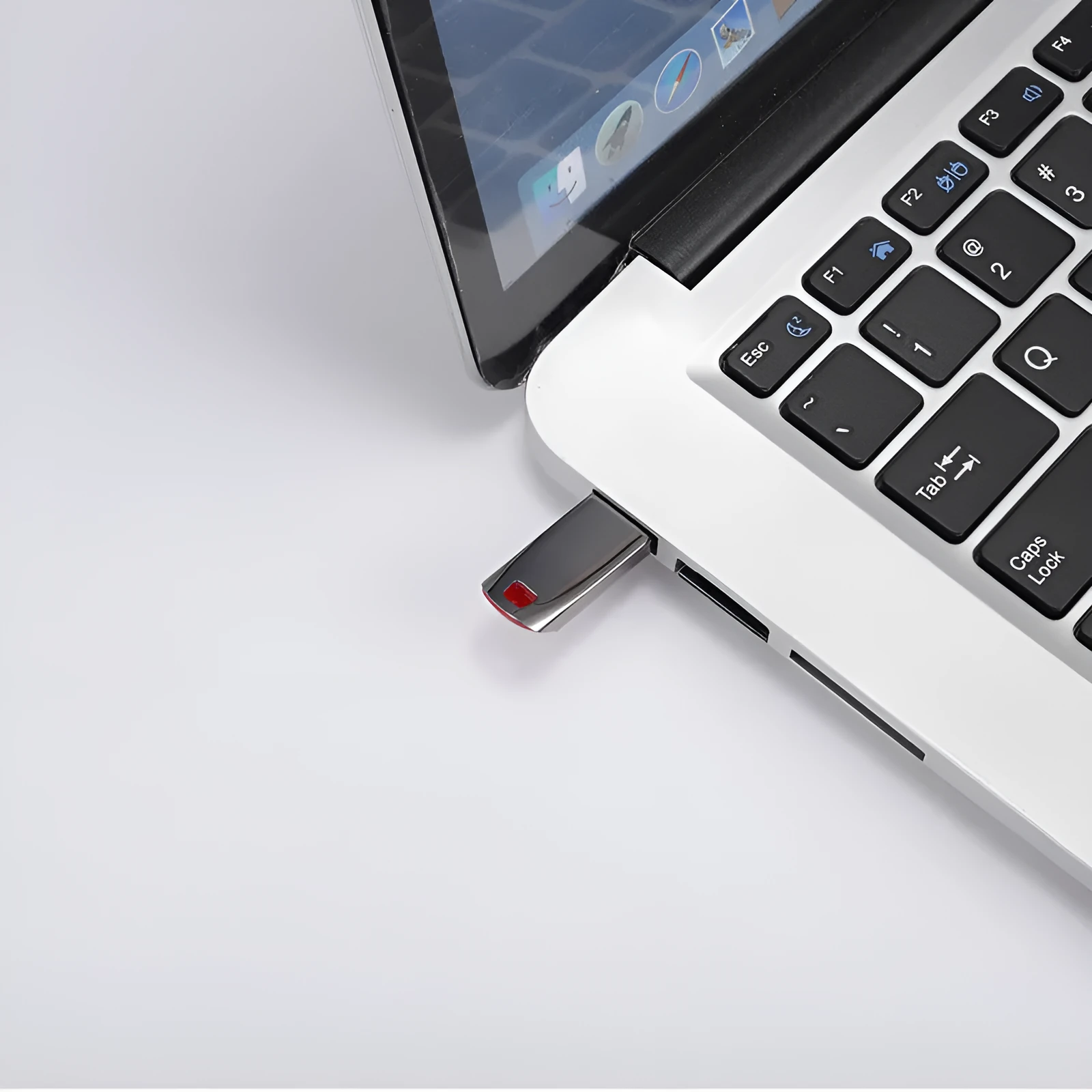 Silver metal USB flash drive with large capacity up to 2TB shown on a dark background