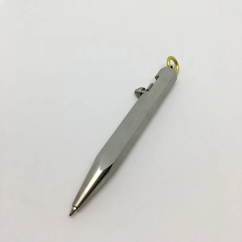 Six-sided stainless steel brass push pen with keychain attachment shown in assorted colours