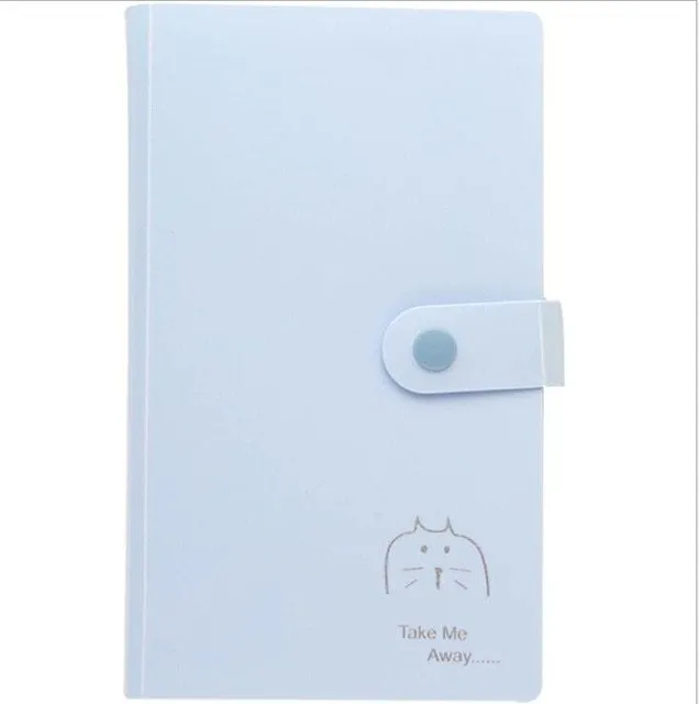 Blue PVC business card holder book with a protective shell and smile logo, shown next to business cards.