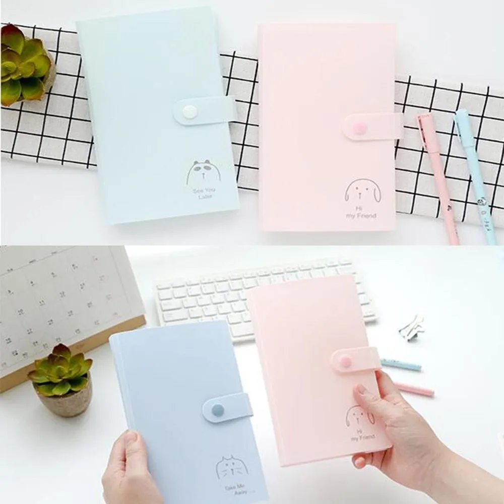 Blue PVC business card holder book with a protective shell and smile logo, shown next to business cards.