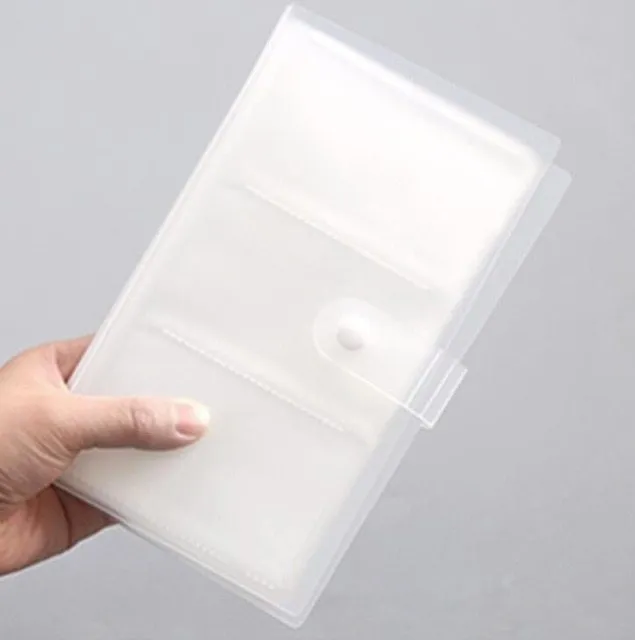 Blue PVC business card holder book with a protective shell and smile logo, shown next to business cards.