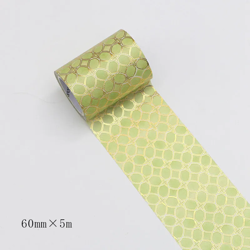 Roll of bronzing and paper decorative tape in gold colour, showing metallic finish.
