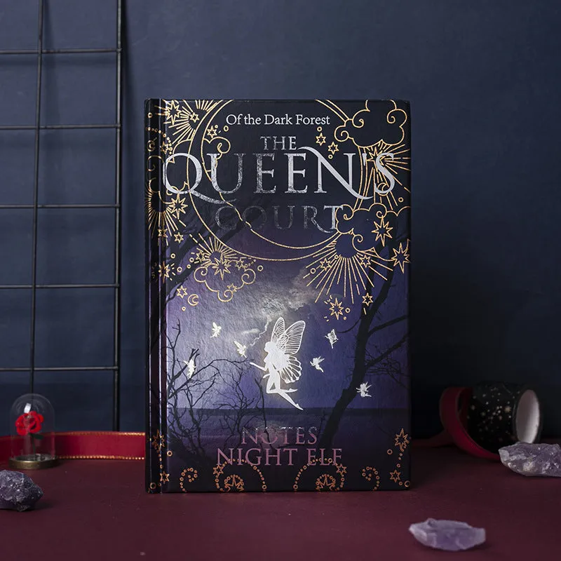 Blue luminous hardcover A5 notebook open to show full-colour Night Elves illustrated pages.
