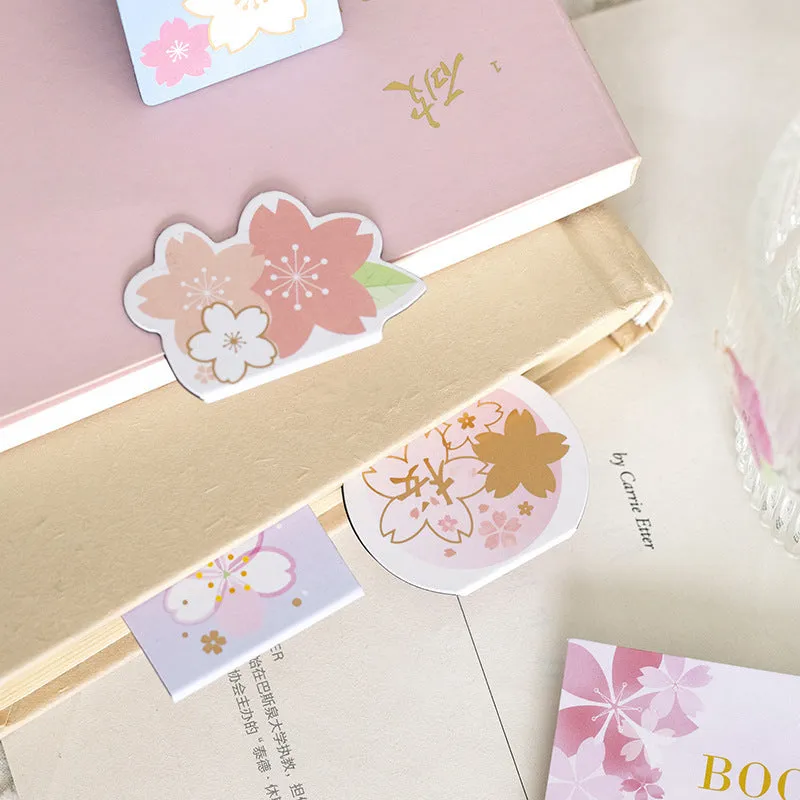 Set of four Yanji cherry blossom magnetic bookmarks showing different sakura designs.