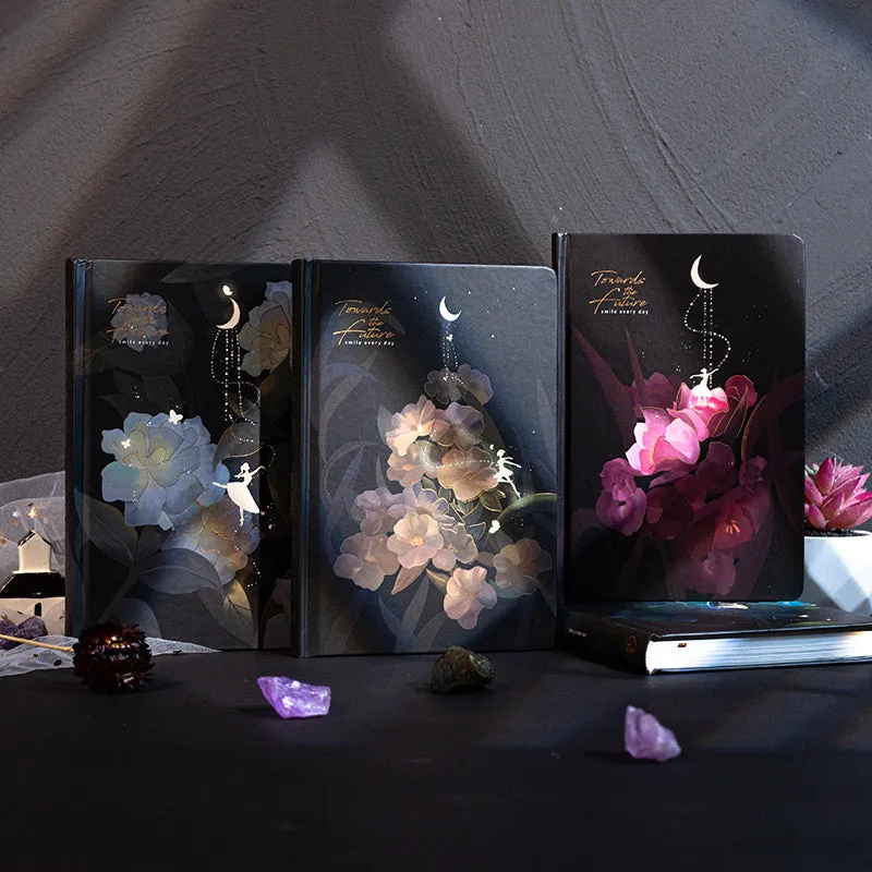 A5 notebook with luminous cover and silver foiling, open to show pages with colour illustrations.