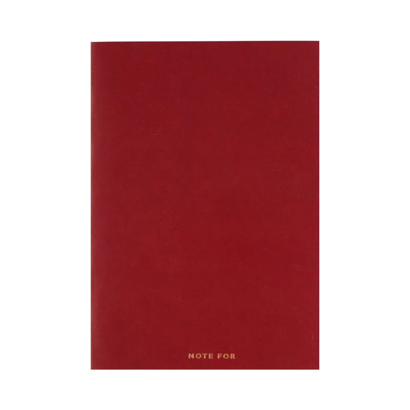 Red imitation leather hand book grid notebook showing inner core dot matrix pages with bronze detailing