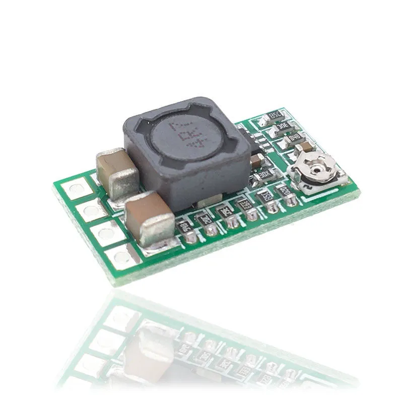 Green mini DC-DC buck converter module stepping 12-24V down to 5V 3A output.