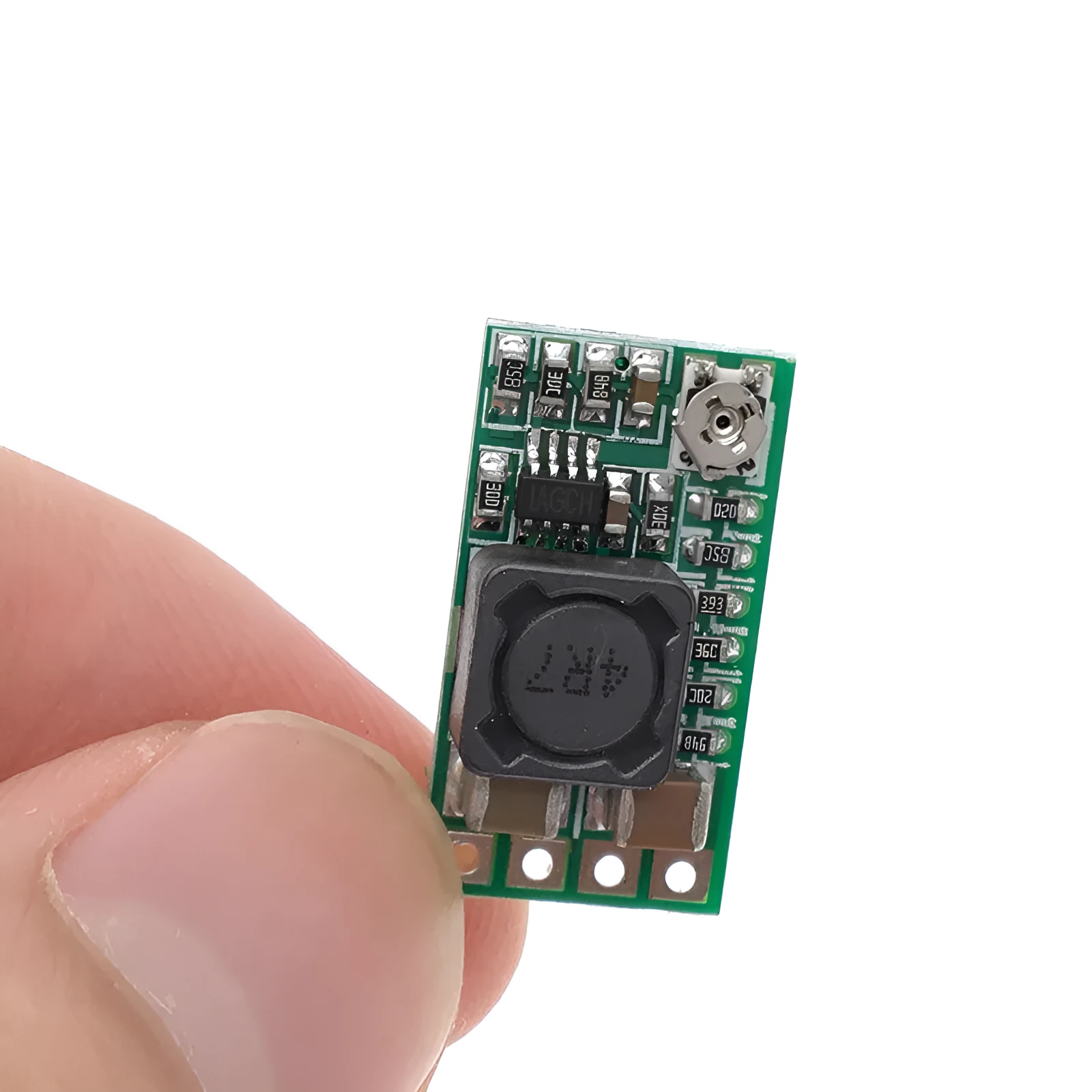 Green mini DC-DC buck converter module stepping 12-24V down to 5V 3A output.