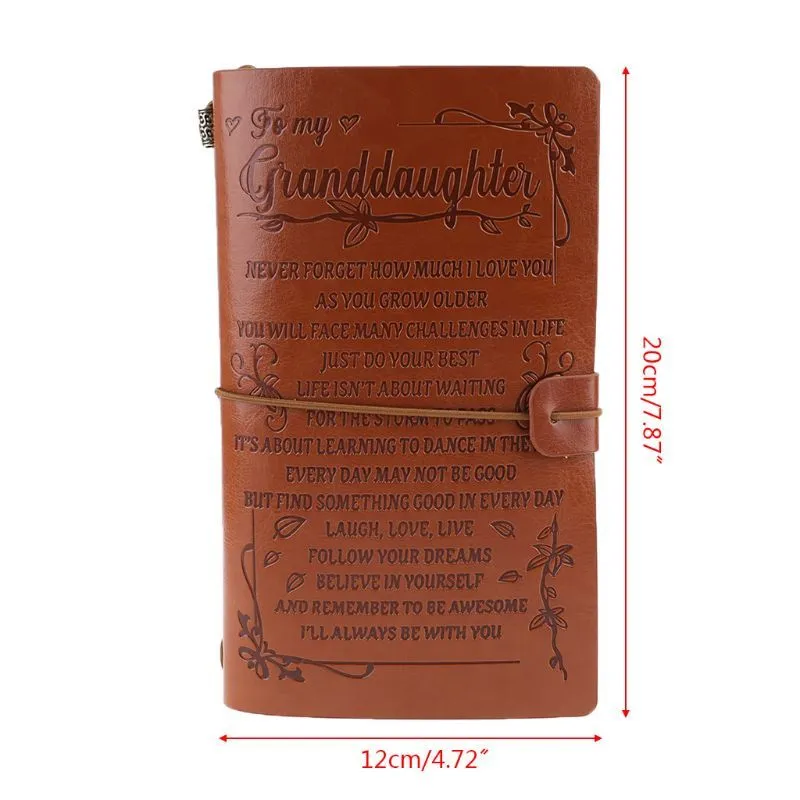 Leather hand ledger notebook with strap binding showing warm brown acid-free paper