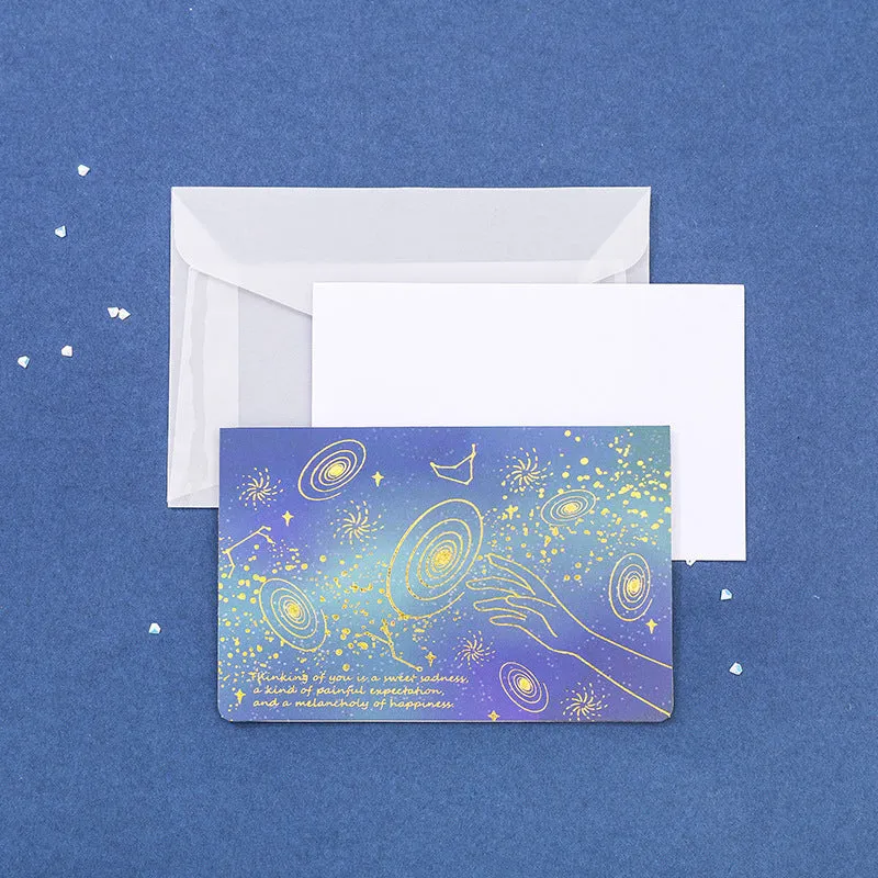 Set of three foldable sulfuric acid paper greeting card envelopes with bronzing, in celestial colours.