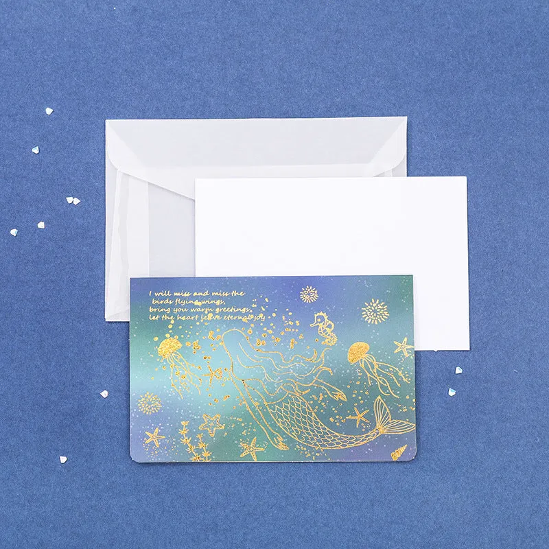 Set of three foldable sulfuric acid paper greeting card envelopes with bronzing, in celestial colours.