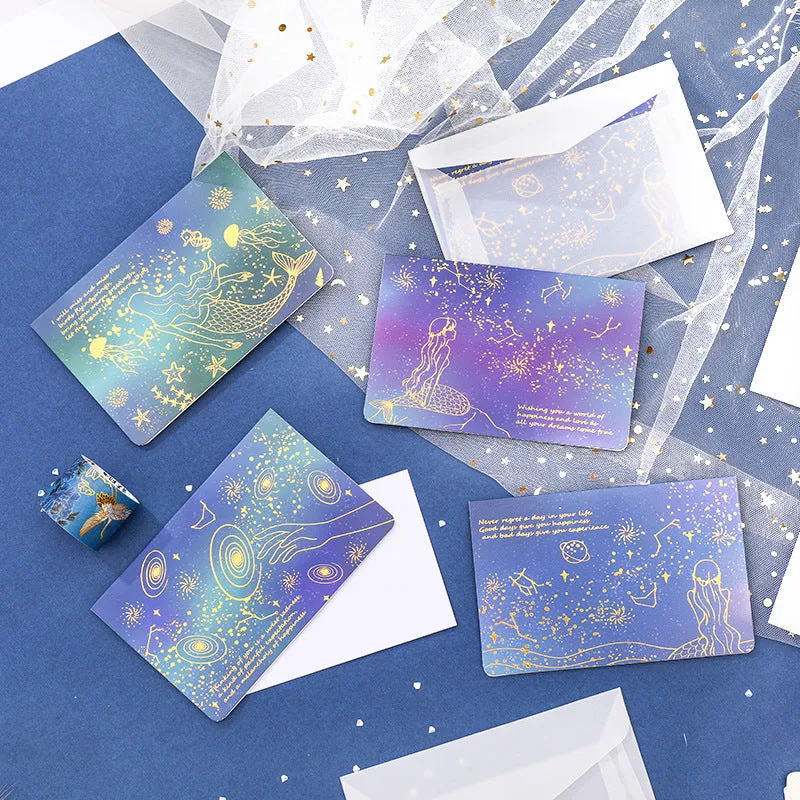 Set of three foldable sulfuric acid paper greeting card envelopes with bronzing, in celestial colours.
