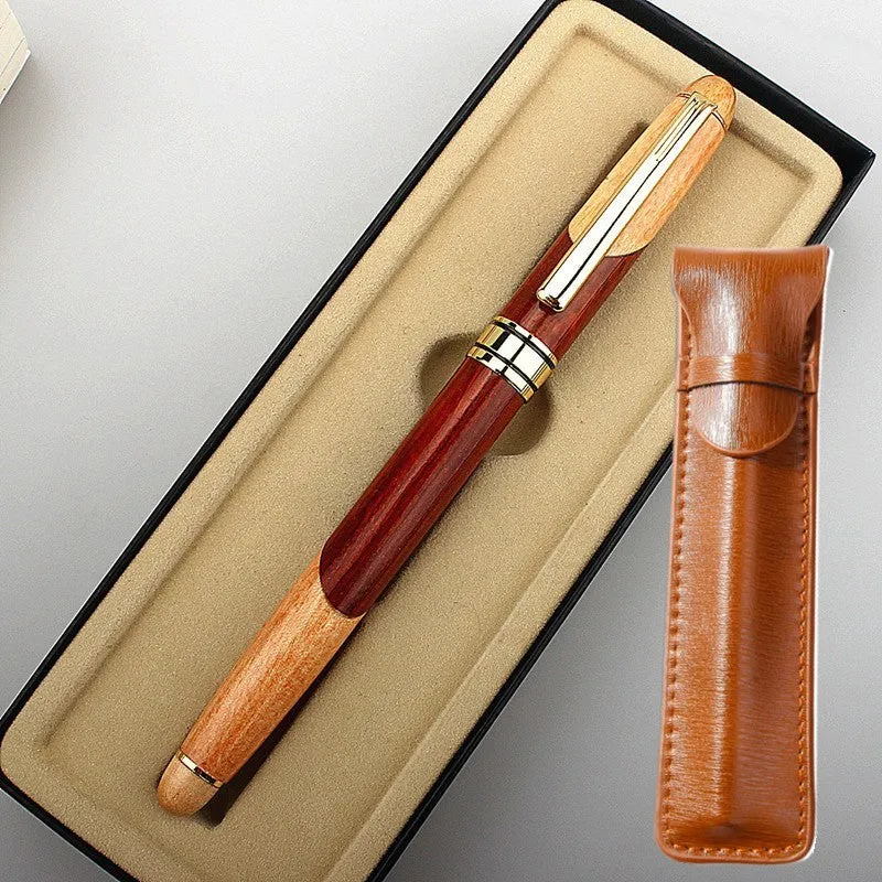 Wooden barrel and metal body pen with a grey fabric storage bag.