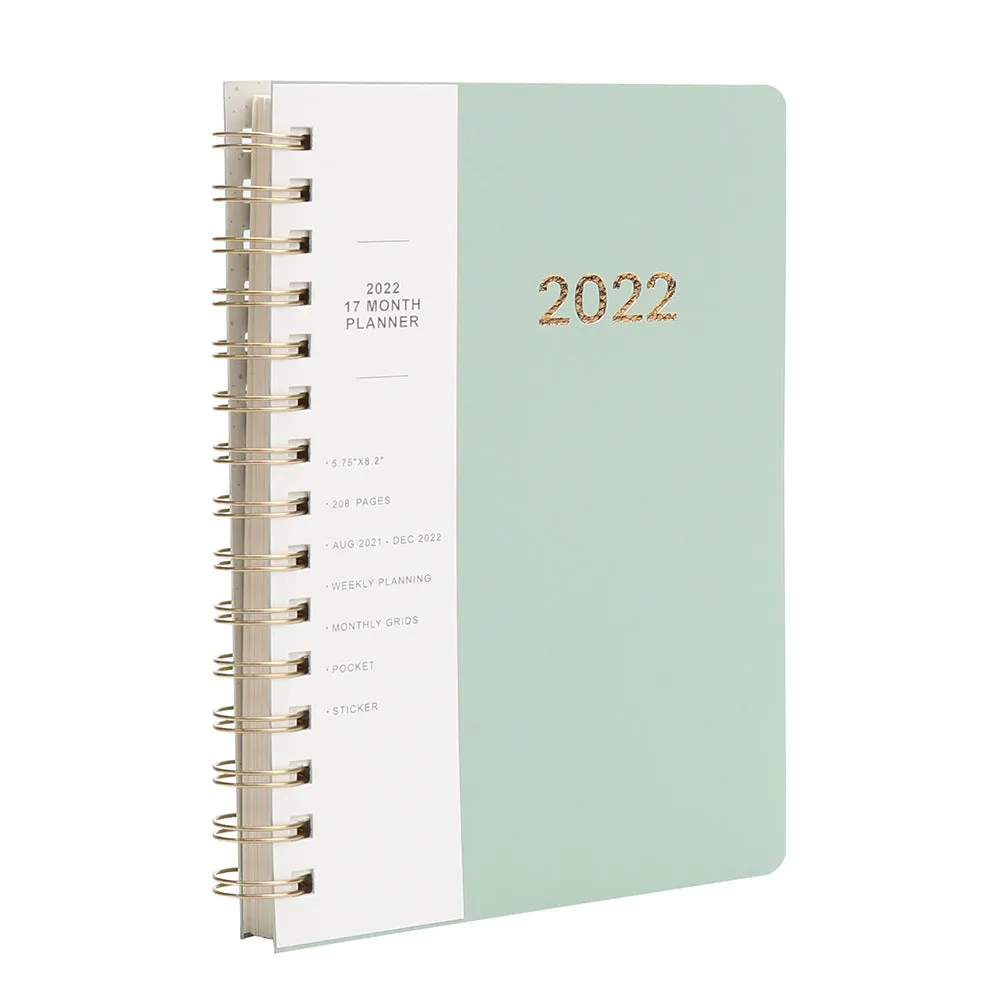 Green and blue 17-month 2022 student planner notebook with coil binding and pockets