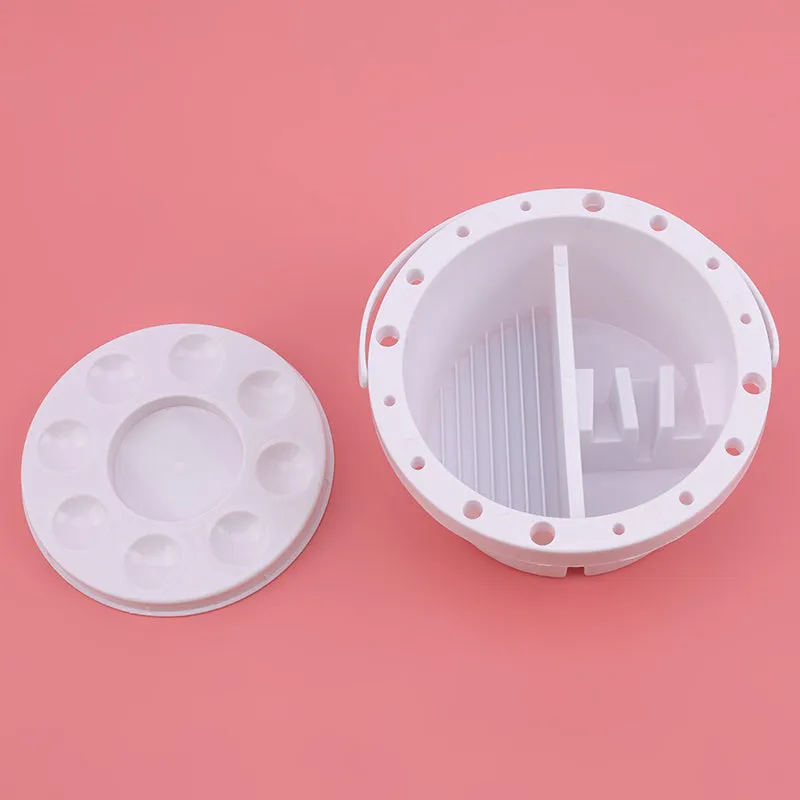 White plastic art brush holder with cake mould design measuring 16.5cm diameter