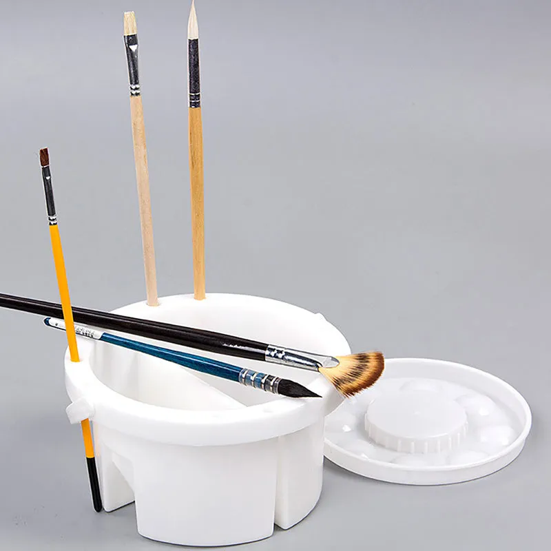 White plastic art brush holder with cake mould design measuring 16.5cm diameter