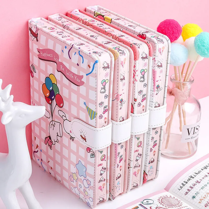 White Kaba Bear Hippo A6 notebook with magnetic buckle and heart design, showing size next to a pen.