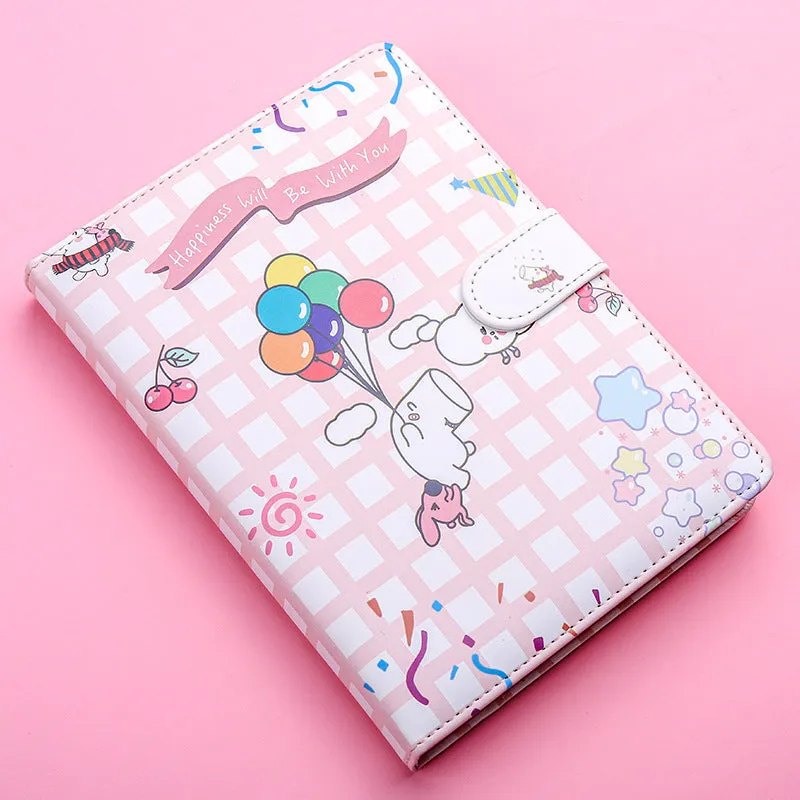 White Kaba Bear Hippo A6 notebook with magnetic buckle and heart design, showing size next to a pen.