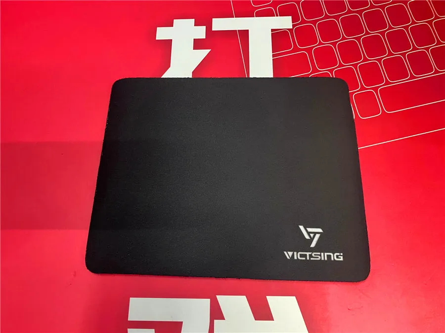 Black thickened rubber gaming mouse pad with rough grain textured surface measuring 270mm by 220mm