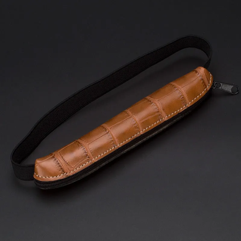 Long slim PU leather pencil case in beige grey, black, black crocodile pattern, and brown crocodile pattern.